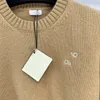 2023 FW Kvinntröjor Knits Designer Tops med brev broderad banan Brand Designer Crop Top Cashmere Shirt High End Elasticity Pullover Outwear Knitwear