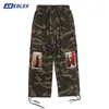 Män s jeans harajuku män breda ben byxor mode mens camo grafisk lapptäck last sommar retro streetwear lösa byxor 230804