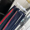 2023 MENS Women Designer Pants Gu Spodni Sprężynowe letnia wstążki Unisex Wysokiej jakości spodnie Rozmiar S-XL