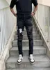 Mäns jeans 2023 Design Estruerad Streetwear Fashion Slim Letters Pattern Patchwork Damaged Ripped Washed Black Man