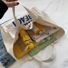 Axelväskor Ny koreansk version Fire Sail Bag Herr- och kvinnors axelväska Portable High Capacity Canvas Bag Student School Bagstylishhandbagsstore