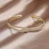 Bangle 14k Real Gold Plating Exquisite AAA Luxury Full Zircon Knot Armband Elegant Womens Wedding Party Opening Justerbar 230807