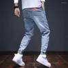 Jeans da uomo Pantaloni da cowboy da uomo Harem Moda coreana Uomo Estate Grafica classica Taglio a stivale Cotone Nero Elastico Strappato Regular