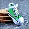 Peças de sapato acessórios moda bonito sapatos esportivos chaveiro mini tênis 3d lona chaveiro mandris de tênis para uni jóias drop delivery