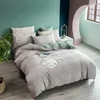 Ensembles de literie magnifique motif de broderie Lotus blanc housse de couette ensemble drap de lit en pur coton taie d'oreiller