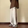 Pantaloni da uomo 2024 Versione coreana da uomo casual allentata La tendenza di tutti i pantaloni da mocio a gamba larga con sensazione di goccia sottile estiva abbinata