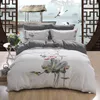 Ensembles de literie magnifique motif de broderie Lotus blanc housse de couette ensemble drap de lit en pur coton taie d'oreiller