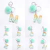 Blå pompom bokstäver nyckelring mode ord nyckelning med puffer boll glitter gradient färg harts hantverk handväska charms hänge