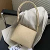 Saco com cordão nicho francês balde de grande capacidade 2023 textura versátil em um ombro temperamento bolsas femininas elegantesdesignerbags