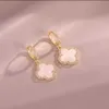 Boucles d'oreilles de styliste à quatre feuilles pour femmes, classiques, petit vent parfumé, trèfle, lumière dorée, Flash