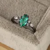 2023 Nuovo anello in argento S925 europeo e americano Anello con smeraldi a quattro artigli Anello con diamanti incastonati ovali Anello nero tinto personalizzato