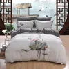 Ensembles de literie magnifique motif de broderie Lotus blanc housse de couette ensemble drap de lit en pur coton taie d'oreiller