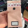 ブランドポータブルメイクアップコンパクトミラーピンクの花のアクリルハンドルミラーストレージポーチバッグ