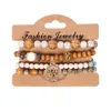 Bracelets porte-bonheur 4pcs / set chaînes de perles en bois de bohème pour les femmes arbre de vie métal rose fleur perles de bois bracelet mode bijoux bohème Dhfye