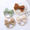 Cute Knitting Wool Bowknot Elastic Hairband Infant Tinta unita Fiocchi all'uncinetto Fascia in nylon Copricapo per bambini Regalo di compleannoZZ