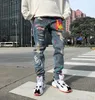 Jeans da uomo Uomo Punk Streetwear Graffiti Stampato Strappato Mendicante Pantaloni a vita bassa skinny Hip Hop Fori per il ginocchio Pantaloni da jogging Pantaloni in denim