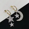 Designerörhängen Guld/silver matchande stjärnor och månen inbäddade zirkon vänster och höger asymmetrisk charmörhängen för kvinnor, banketter, bröllop, fester