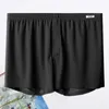 Underpants Men Summer Shorts Soft Ice Silk Sleep Elastyczna talia pusta plamowana plaża nad odzieżą domową o długości kolan