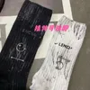 Autumn New European Goods Distressed Dirty Socks Women's Letter Printed Metal Pendant Tube Sock Personalized Trendy Socks Neutral