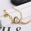 Luxury Tiff fashion brand jewelry Titanium steel sweet and minimalist style T lettering hollow out love asymmetric chain bracelet female titanium 18k gold