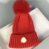 Designer winter gebreide beanie wollen hoed vrouwen dikke gebreide dikke warme faux bont pom muts hoeden vrouwelijke motorkap caps 11 kleuren gebreide hoedhoeden voor vrouwen met rand mannen