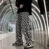 Pantaloni da uomo Ins Tide Mopping gamba larga a scacchiera in bianco e nero a scacchiera in velluto dritto.