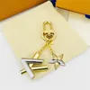 High quality luxury letter inlaid astronaut enamel high-quality keychain men's and women's jewelry keychain luxury brand bag pendant as a gift for family and friends