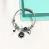 Bangle Design Flower Charm Pendant Crystal Plastic Bead Stainless Steel Bracelets