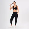 Aktiva uppsättningar Yoga Set Woman Gym Women Fitness Sportwear Sports Workout Clothes for Bra Pants stockfast med PAD