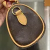 Borsa di design popolare Borsa da viaggio NONO per donna Borsa da viaggio classica in tela stampata con tracolla a catena in pelle dorata con patta Mini confezione regalo