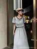 Basic & Casual Dresses designer 23 Summer New Contrast Short Sleeve Round Neck Dress with Elastic Waist and Large Hem Inverted Triangle Label embellishment XNAF