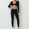 Set attivi set senza soluzione di continuità yoga sport fitness ad alta vita pantaloni che lirano all'anca nuda sentono i leggings da palestra per le donne a maniche lunghe set per donne