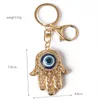 Klaki Bling Eye Eye Hamsa Ręka Blak Klapeta Bag worka Klucz Pierścienie Mężczyzn Crikon Akcesoria samochodowe Metalowe klamry