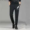 Męskie dżinsy 2022 Nowe jogging męskie spodni płaskie dna modne uliczne odzież męskie spodnie towarowe fitness gym sportowe spodnie męskie odzież Z230814