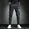 Pantaloni maschili uomini uomini mimetizzati elasticità pantaloni cargo militari che colano a più tasche pantaloni da jogger casual 230811