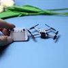 Poupées dji fpv mini machine de traversée miniature mine de drones uav modèles à main ornements 16 soldat bjd dollhouse jouet 230811