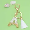 Keychains Lanyards Creative 26 Letter Resin Keychain Pendant With White Tassel Keyring Charms Men Women Bag Ornaments Accessories Souvenir Gifts