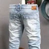 Jeans masculinos Moda de streetwear Men retro azul claro elástico slim ripped patches designer vintage calça jeans casual hombre