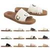 Tasarımcı Woody Sandallar Kadın Plaj Sandal Katırları Düz ​​Slaytlar Açık Tenli Bej Beyaz Siyah Pembe Dantelli Yazı Kumaş Ton Ters Terlik Kadınları Yaz Açık Ayakkabıları X27