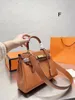 Lyxdesigner Elis New Cowhide Epsom läder axel crossbody väska Klassisk tryckt bokstäver för kvinnor mångsidig kvinnors minihandväska