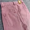 Jeans pour femmes fourre-tout nordique 2023 printemps / été lavage d'eau rouge pantalon à la taille mi-taie effilée