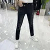 Jeans masculinos harajuku alongamento de luxo em estilo coreano slim para homens com bordados e impressão de calças casuais pretas diamantes