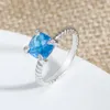 Anello di dichiarazione alla moda a 4 punte con montatura da 8 mm di zirconi blu, anelli di design gioielli per donne e uomini