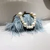 Sacs de soirée Sac de marque de luxe sac mode portefeuille femme rétro lux d'épaule Tempérament des plumes de perle de perle craquette 230811