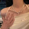 デザイナーのRovski Luxury Top Jewelry Accessoriesダブルレイヤーパールクラビクルチェーン小さくて人気のあるデザインファッショナブルな性格ユニークなネックレス女性