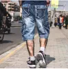 Mäns jeans 2023 Summer Men oroliga jeanfickor Streetwear dragkedja man kalvlängd blå denim byxor ljus