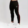 Pantaloni maschili di alta qualità sik seta di seta poliestere poliestere fitness casual addestramento quotidiano sport jogging