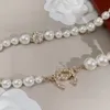 23SS Designer Pearl Naszyjniki dla kobiet Diamond Logo Wisidant Biżuteria Wysokiej jakości naszyjnik z koralikami, w tym prezent na panie marki