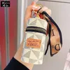 Anahtarlıklar lüks lüks deri kova ruj çanta ipek fular anahtarlık enfes kişiselleştirilmiş depolama çantası kolye kadın aksesuarları anahtarlık hediyesi
