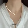 S925 Collier asymétrique de perle d'eau douce naturelle en argent pour la chaîne de cols en forme de coeur de style cool aux femmes